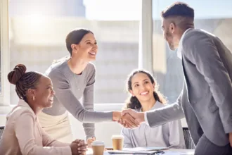 Shot of two businesspeople shaking hands during a meeting in an picture id1338753777