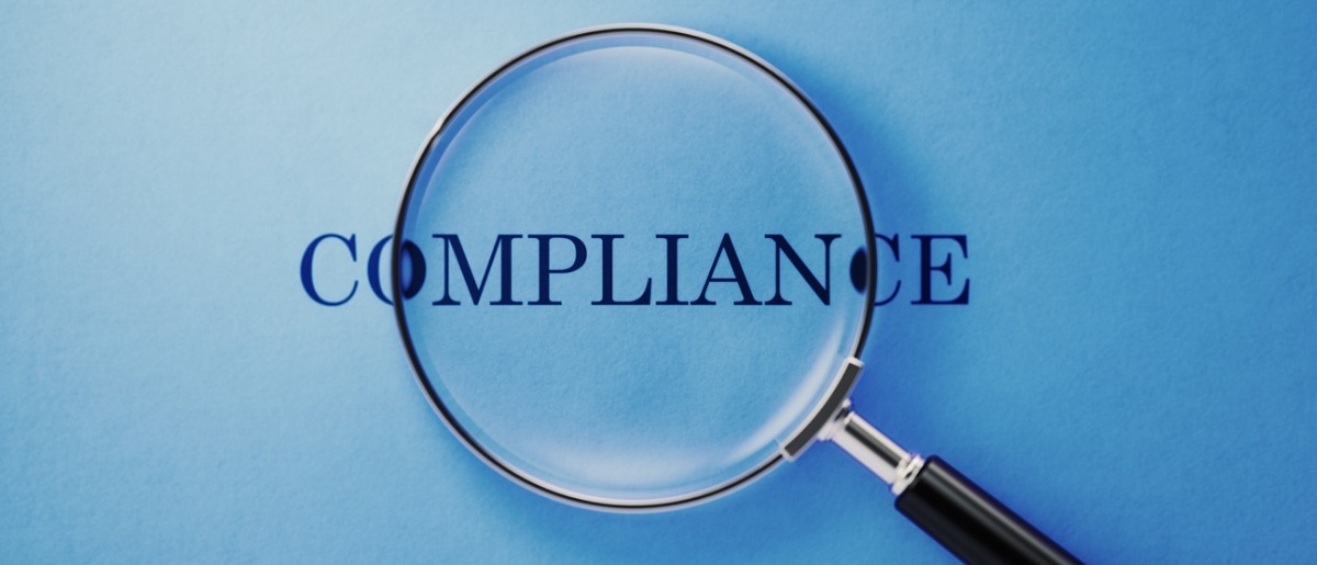 Compliance concept magnifier and compliance text on blue background picture id1141747853