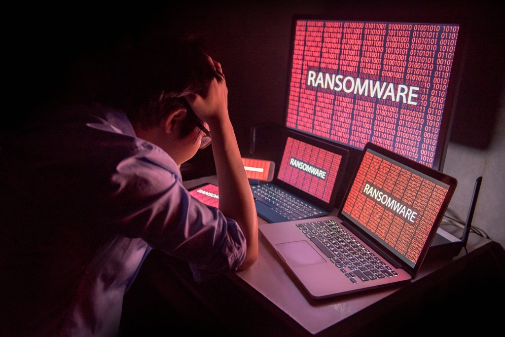 Young asian male frustrated by ransomware cyber attack picture id845470768